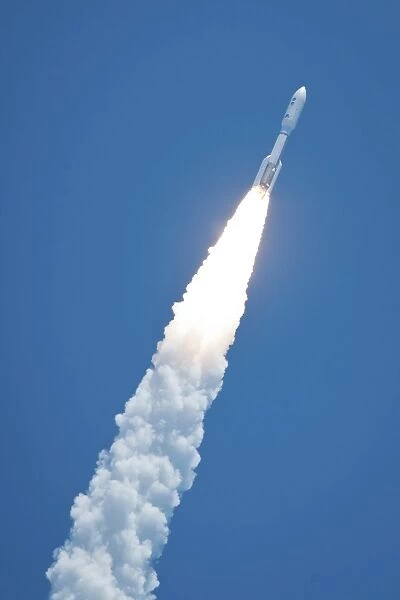 An Atlast V rocket carrying the Juno spacecraft during a midday launch