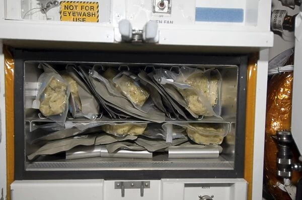 Bags of food stored inside the galley on Space Shuttle Endeavour