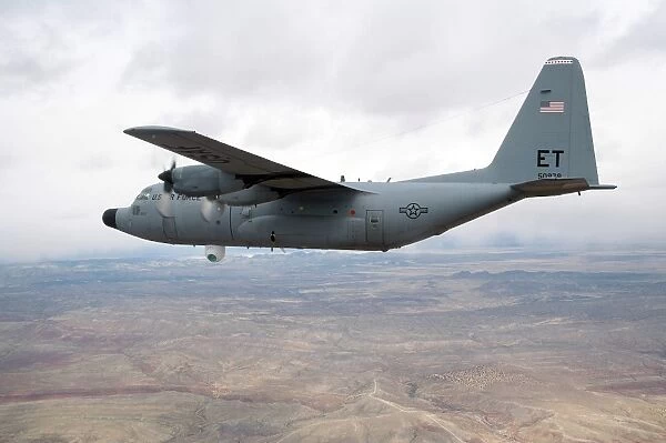 A C-130 Hercules soars through the sky