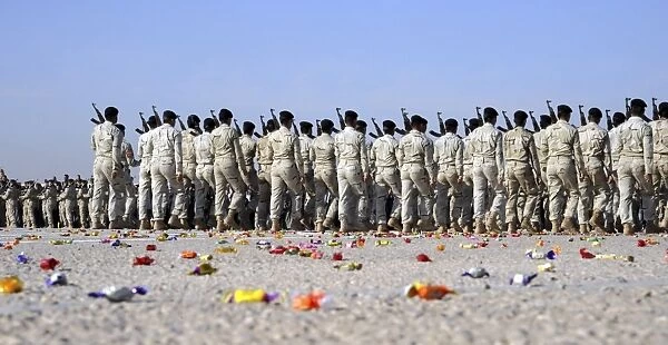 Candy covers the parade grounds during a pass in review at an Iraqi Air Force officer