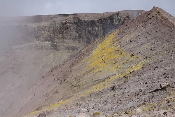 Degassing North crater with fumarolic sulphur deposits. Mount Etna volcano, Sicily, Italy