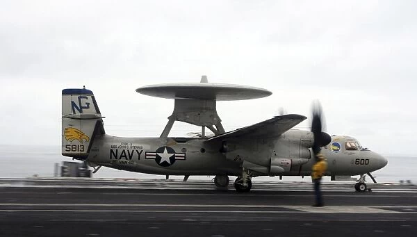 An E-2C Hawkeye launches from the flight deck of USS John C. Stennis