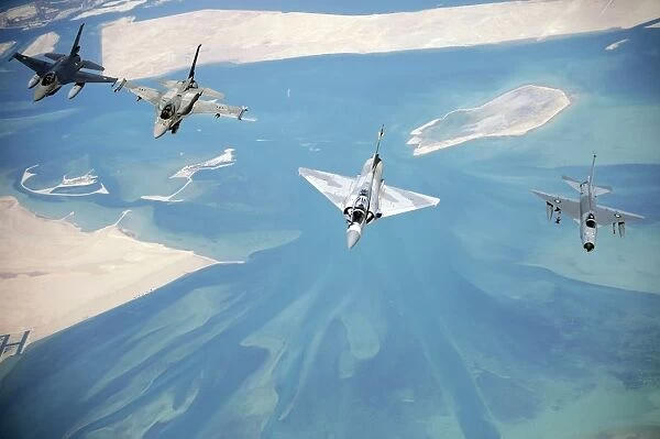 Emirati F-16s, an Emirati Mirage 2000, and a Pakistani F-7 fly in formation during