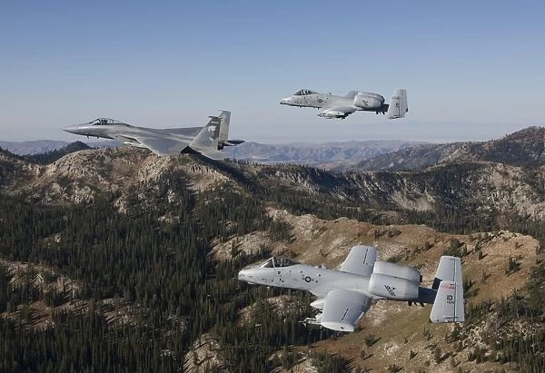 An F-15 Eagle and two A-10 Thunderbolts in flight over Central Idaho