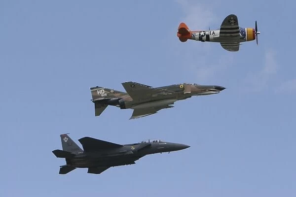 An F-15 Eagle, P-47 Thunderbolt, and F-4 Phantom fly a heritage flight