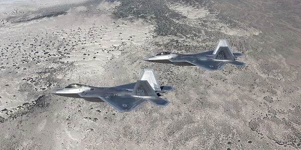 Two F-22 Raptors fly a training mission over New Mexico