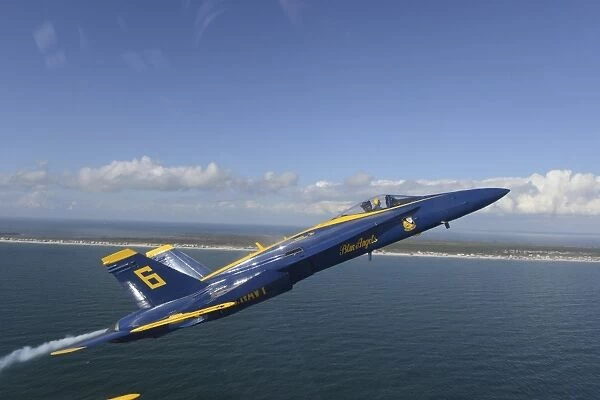 An F  /  A-18 Hornet from the Blue Angels during a training flight