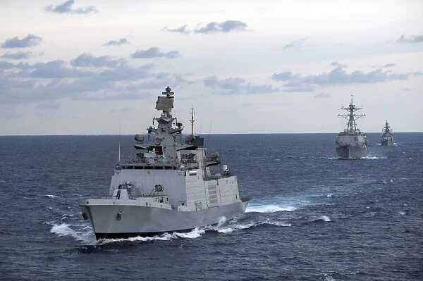 The Indian Navy frigate INS Satpura is underway with U. S. Navy ships