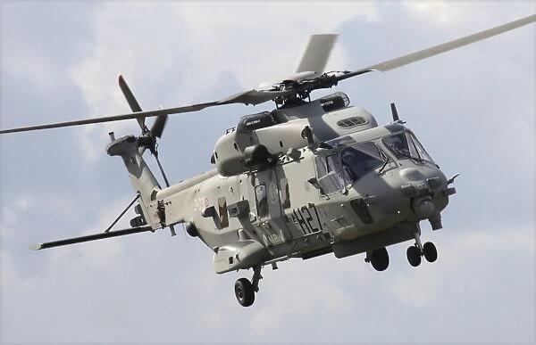 An Italian Navy EH101 helicopter prepares for landing