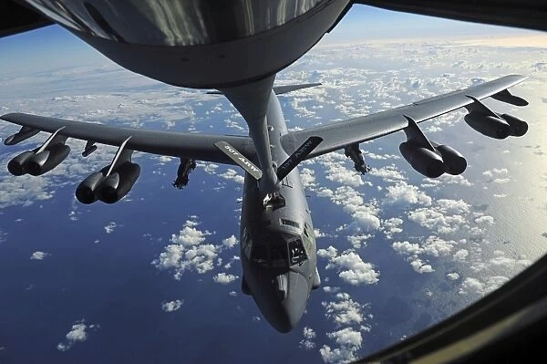 A KC-135 Stratotanker aircraft refuels a B-52 Stratofortress aircraft over the Pacific