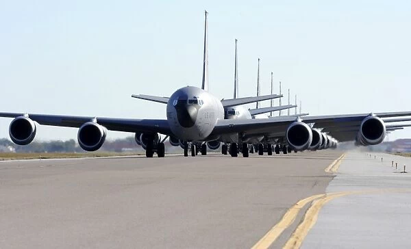 KC-135 Stratotankers in Elephant Walk formation on the runway