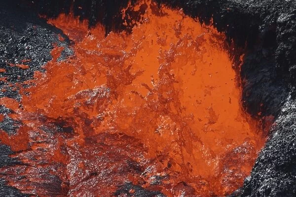 Lava bursting at edge of active lava lake, Erta Ale volcano, Danakil Depression, Ethiopia
