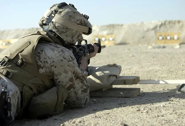 A Marine fires a M16A2 service rifle to acquire a battle sight zero