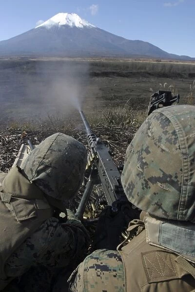 Marines fire an M2. 50 caliber machine gun