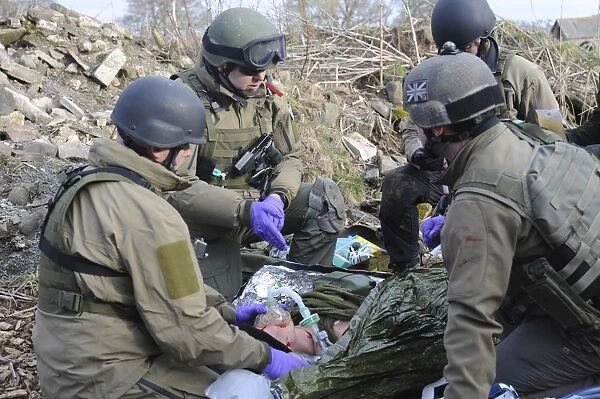 Medics of the British Special Forces provide first aid to a simulated victim