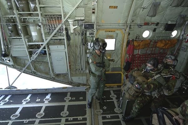 Members of the Pathfinder Platoon await to jump from a Royal Air Force C-130 Hercules