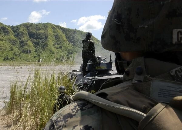 Members of the Philippine Armed Forces fire the weapons systems of a light armored