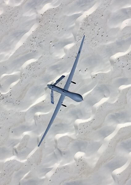 An MQ-1 Predator flies over the White Sands National Monument, New Mexico