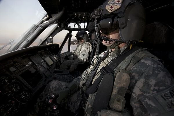 Pilot in the cockpit of a UH-60L Blackhawk helicopter