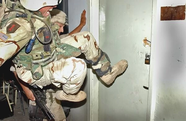 US Soldiers secure one of the stronghold buildings