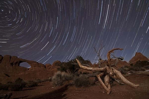 Star trails over Skyline Arch at Arches National Park, Utah