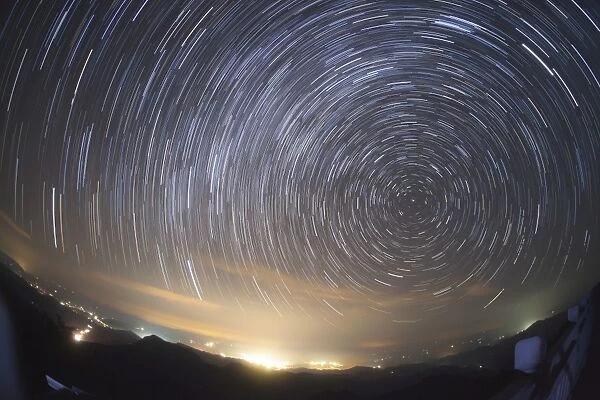 Stars circle around the north celestial pole above Nanchang city, China