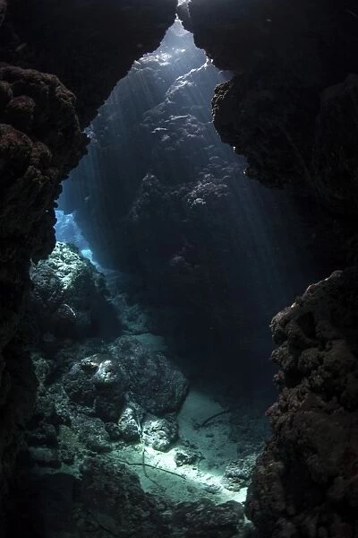 Sunlight pours into a submerged cavern on a reef in the Solomon Islands
