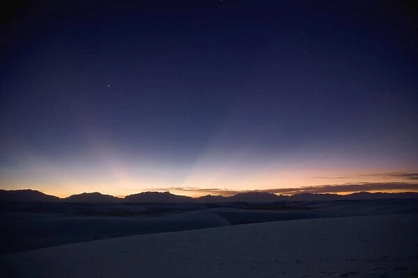 Sunset landscape depicting crepuscular rays