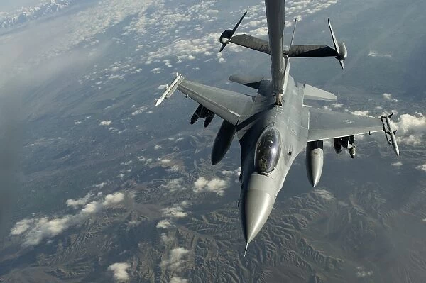 A U. S. Air Force F-16C Fighting Falcon conducts aerial refueling