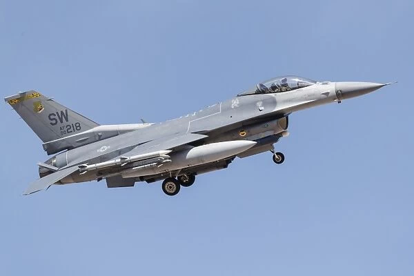 A U. S. Air Force F-16C turns on to final approach at Nellis Air Force Base, Nevada