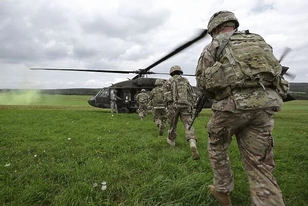 U. S. Army soldiers board a UH-60 Black Hawk helicopter