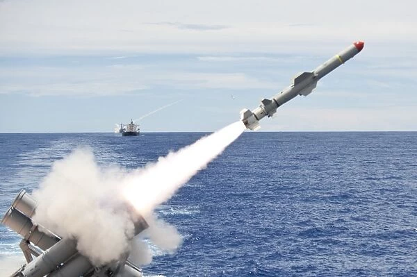 USS Cowpens launches a Harpoon missile from the aft missile deck