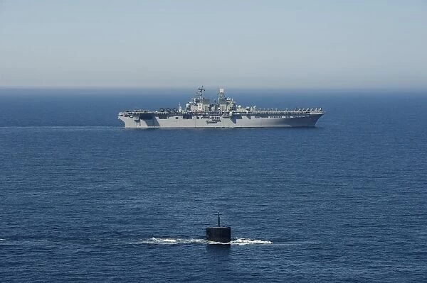 USS Hampton transits alongside USS Makin Island