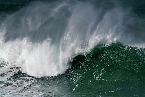 Large wave, known locally as The Cribbar, breaking offshore, Fistral Beach, Newquay, Cornwall, Atlantic Ocean, UK. March, 2022