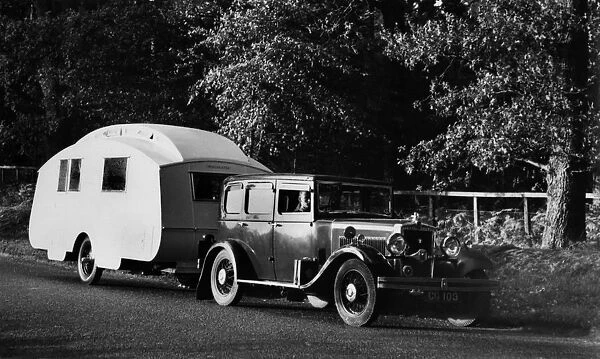1931 Morris Isis saloon with Winchester caravan. Creator: Unknown