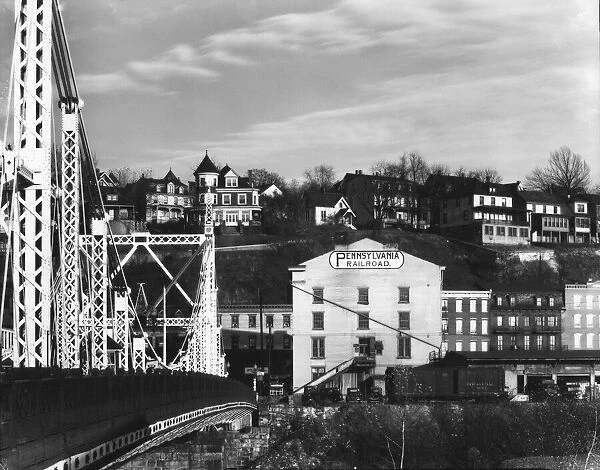 Bridge and houses in Phillipsburg, New Jersey; seen from Easton, Pennsylvania, 1935. Creator: Walker Evans