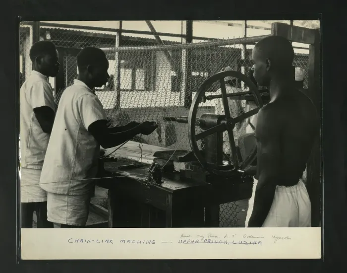 Framed Print : Chain Link Machine Print, Uganda Prison Scene Framed Print : Chain Link Machine Print, Uganda Prison Scene