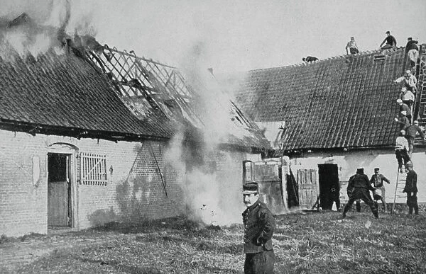 French soldiers fight a fire started by German incendiary bombs, Artois, World War I, 1915
