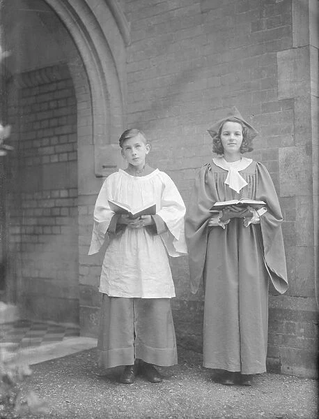 Girl and boy chorister, (Isle of Wight?), c1935. Creator: Kirk & Sons of Cowes