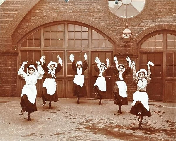 Girls morris dancing in playground, Thomas Street Girls School, Limehouse, Stepney, London, 1908