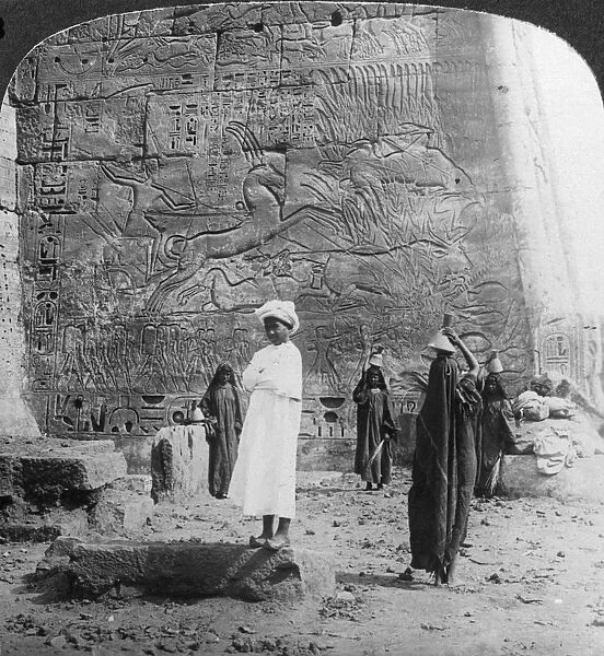 The hunting of the wild bull, carved on a tempkle wall at Medinet Habu, Thebes, Egypt, 1905. Artist: Underwood & Underwood