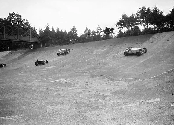 Invicta, Talbot and Frazer-Nash cars racing on the Members Banking at Brooklands