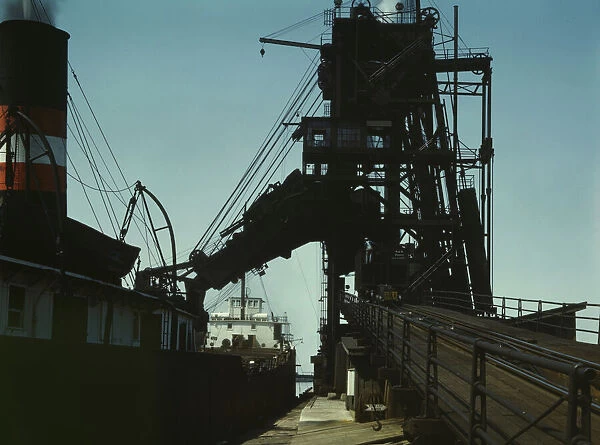 Loading a lake freighter with coal for shipment to other lake ports, Sandusky, Ohio, 1943. Creator: Jack Delano
