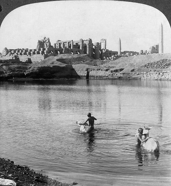 Looking across the Sacred Lake to the great temple at Karnak, Thebes, Egypt, 1905. Artist: Underwood & Underwood