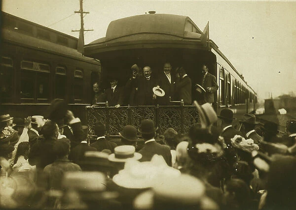 Russian diplomats waving at crowds from the back of a train car, 1905. Creator: Unknown