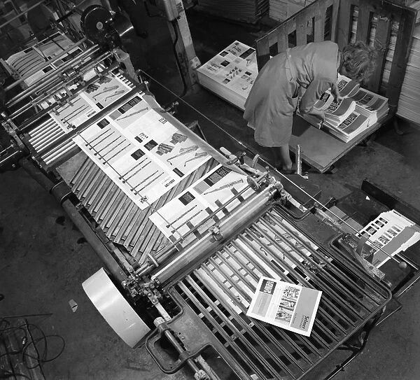 Stacking finished brochures at a printers, Mexborough, South Yorkshire, 1959. Artist
