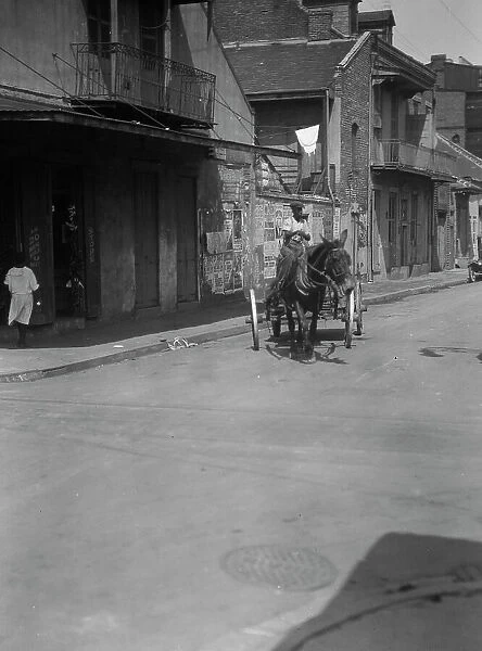 Street scene in the French Quarter, New Orleans, between 1920 and 1926. Creator: Arnold Genthe