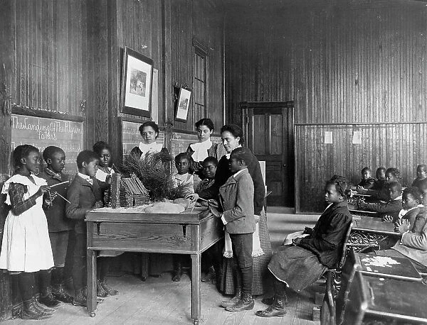 Thanksgiving Day lesson at Whittier, 1899 or 1900. Creator: Frances Benjamin Johnston