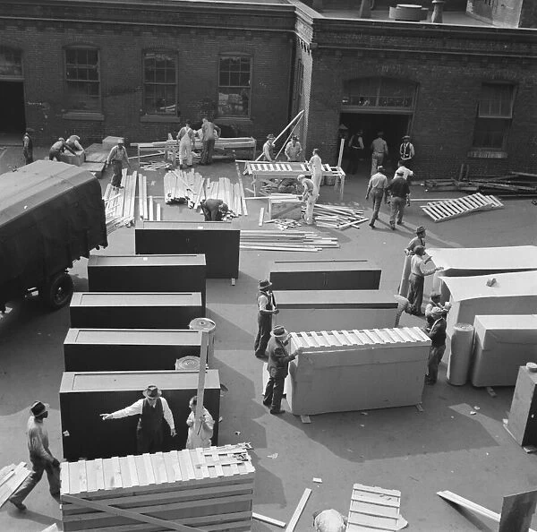 United States government workers and carpenters making crates for steel... Washington, D.C. 1942. Creator: Gordon Parks