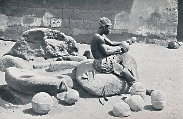 A Yoruba man engraving clay bowls and water jars, Lagos hinterland, Southern Nigeria, 1912. Artist: AW Gelston